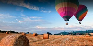 Hot air balloons over a rural setting