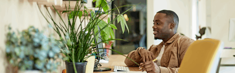 man learning in green office space
