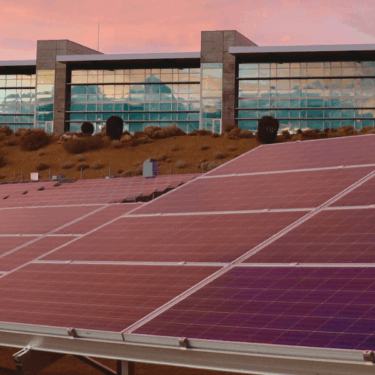 a sustainable building depicting solar panels beneath it