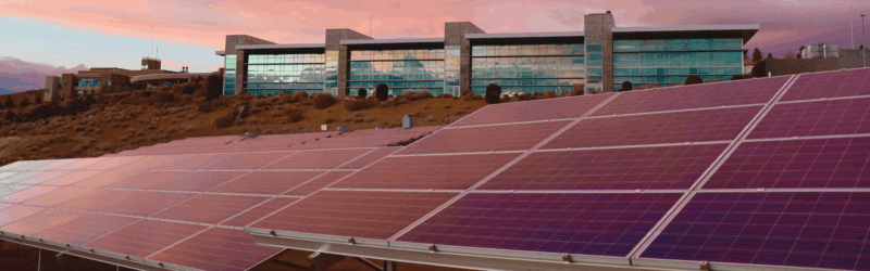 a sustainable building depicting solar panels beneath it