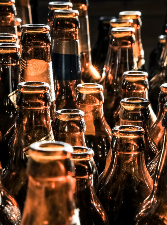 Rows of empty glass beer bottles
